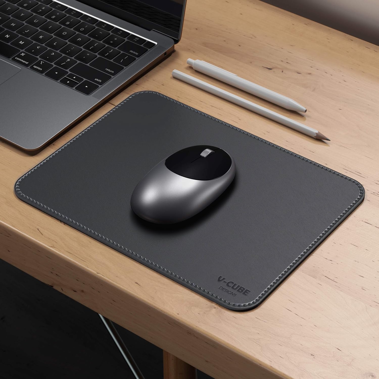 A slim mouse pad for laptop sliding easily into a laptop sleeve bag for travel.