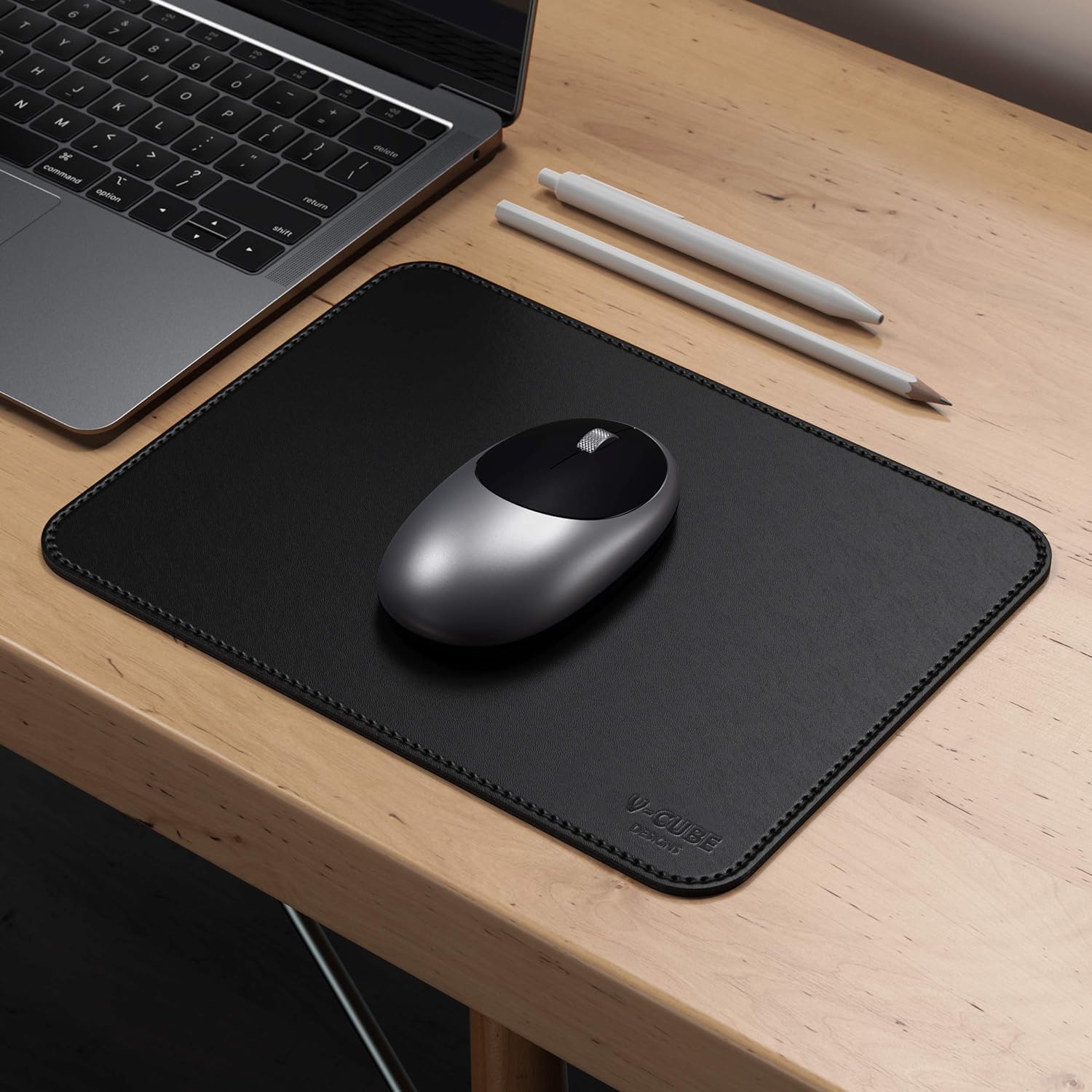 Side angle view showing the 2.4mm thickness of a cushioned leather mouse pad.