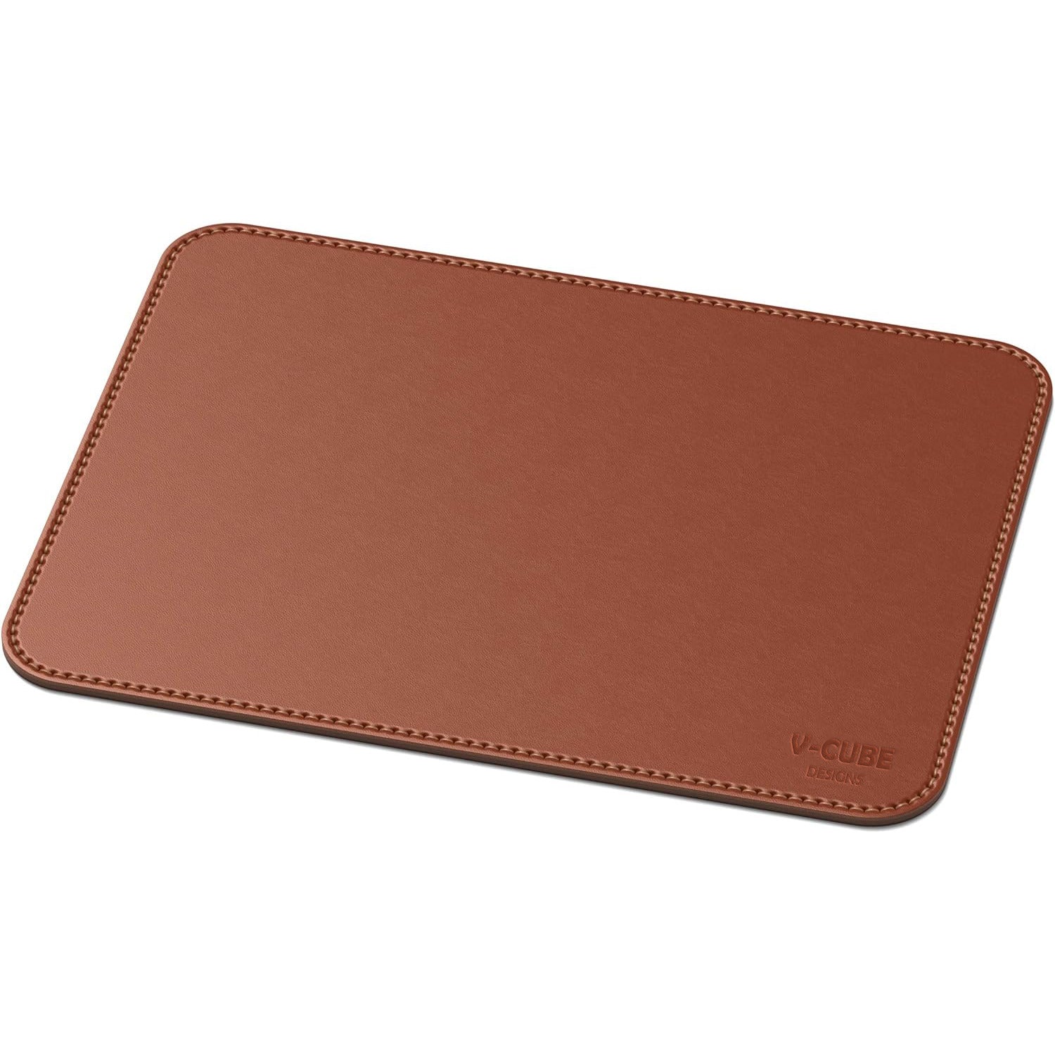 Reversible dual-sided tan premium mouse pad demonstrating anti-skid surface grip on a glass desk.